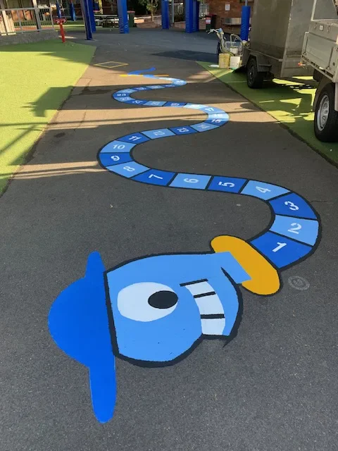 Colourful numbered hopscotch grid on a school asphalt playground